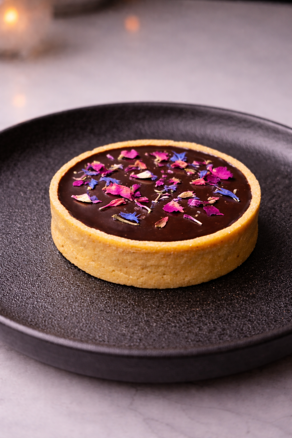Tartelette with almond crèmeux and cocoa glaze
